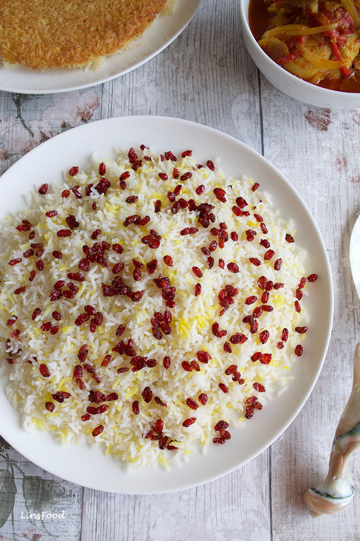 plate of rice topped with tiny red berries called barberries, zereshk in Persian